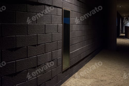 Preview: Alleyway along a brick wall and fence under light