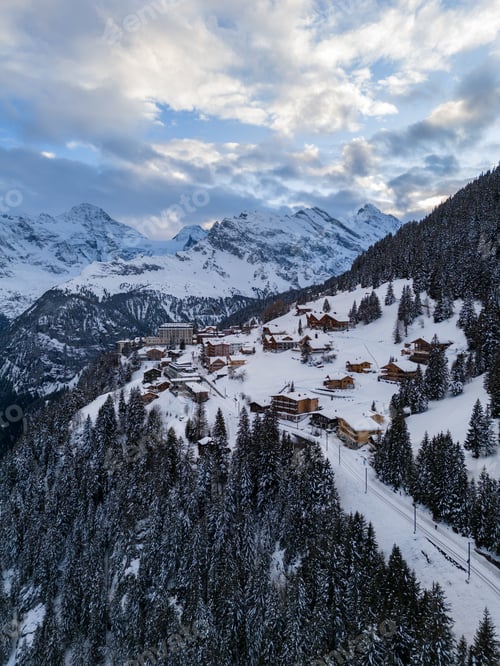 Preview: Murren Town and Mountains in Winter Evening. Switzerland. Aerial View