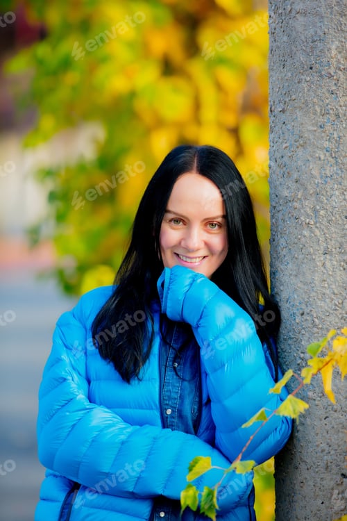 Preview: Young girl in blue jacket at alley