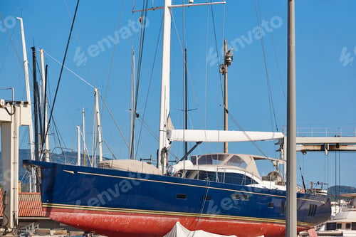 Preview: Sailboat on an outdoor shipyard. Nautical maintenance industry. Repair