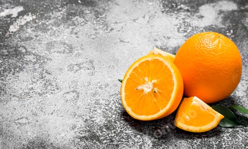 Preview: Ripe oranges with green leaves.