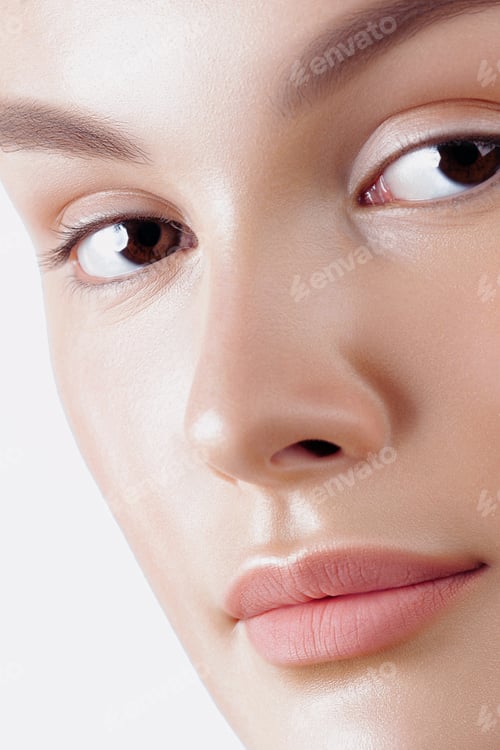 Preview: Close-up of young caucasian female with smooth skin and neutral makeup