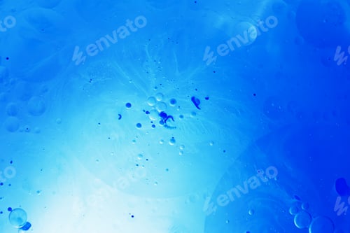 Preview: Oil bubbles close up. circles of water macro. abstract light blue background