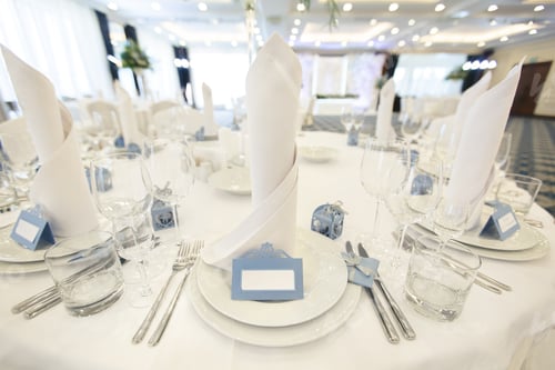 Preview: Beautiful setting of the wedding banquet table in the restaurant with the name of the guest