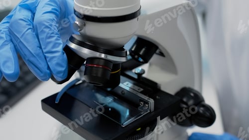 Preview: Close up of microscopic glass tray on optical instrument
