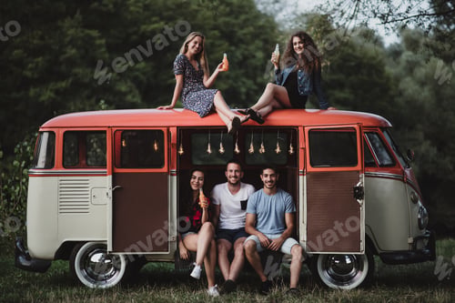 Preview: A group of friends at dusk outdoors on a roadtrip through countryside.