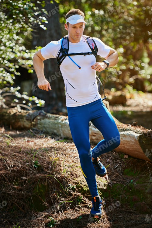 Preview: He loves a good trail run. Shot of a young man running along a nature trail.