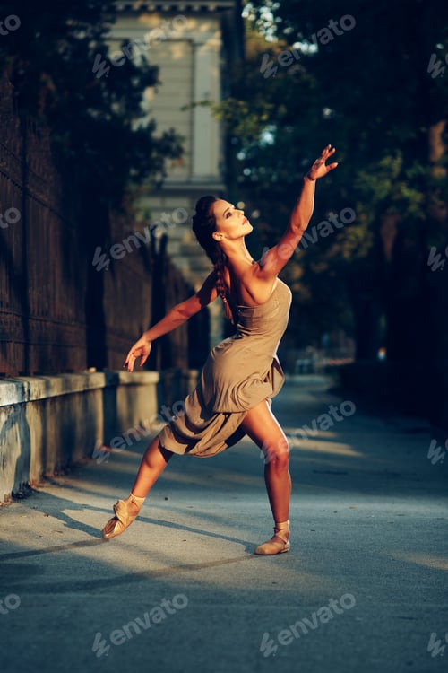 Preview: Young beautiful ballerina dancing on the sidewalk