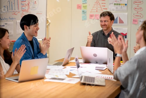 Preview: Professional manager show thumbs up during meeting in conference room with other team clapping