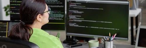 Preview: Female IT Developer Writing Code on Computer