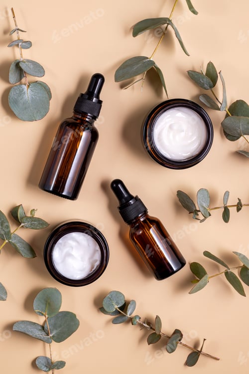 Preview: anti-aging collagen facial serum in glass bottle and face cream on beige pastel background