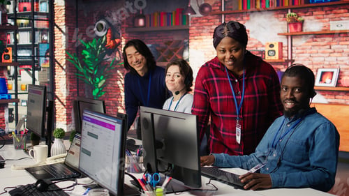 Preview: Portrait of smiling multiethnic call center agents helping customers