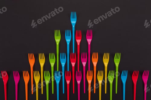 Preview: Many color plastic forks on a bright background