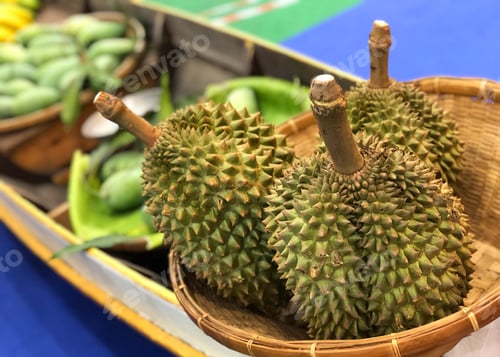 Preview: Durian fresh fruit closeup on wooden boat blur background
