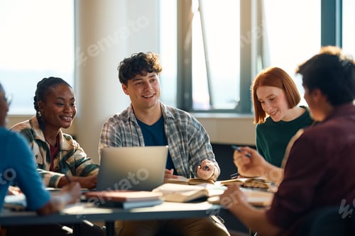 Preview: Multiracial group of happy students learning together at the university.