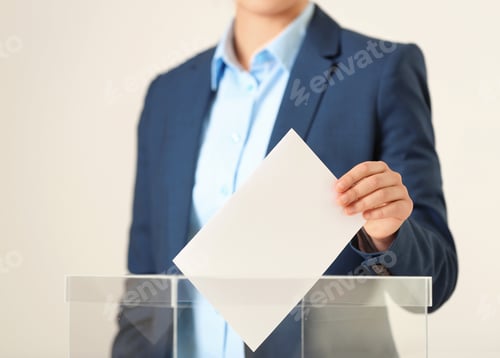Preview: Woman putting vote into ballot box against light background, closeup