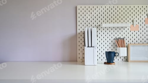 Preview: Copy space office desk with document file, coffee and peg board with pencil on table.