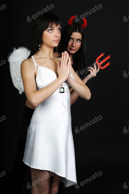 Preview: Two girls posing in costumes of angel and demon