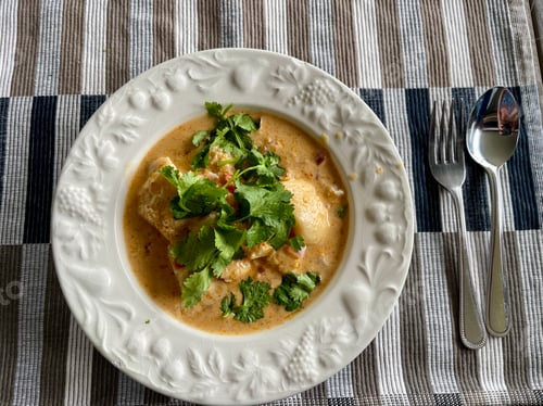 Preview: Bowl of Creamy Soup Garnished with Fresh Herbs