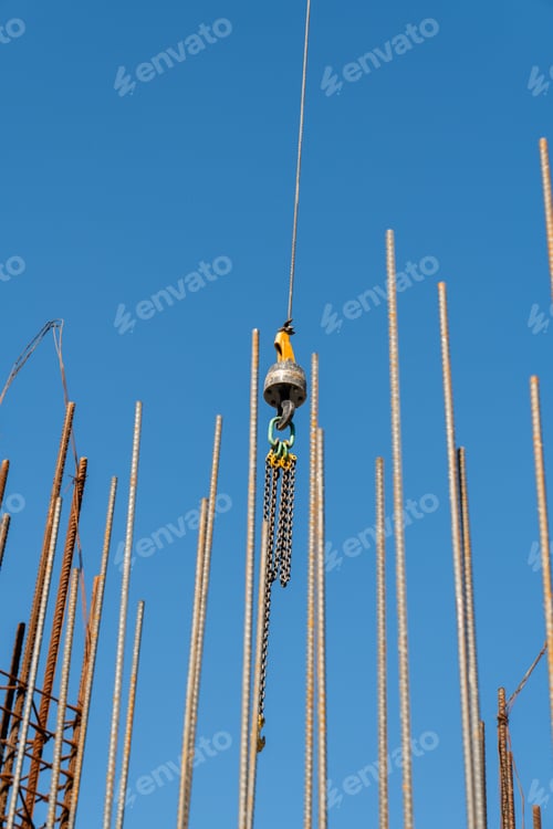 Preview: Construction crane arm with Jib crane boom against blue sky background