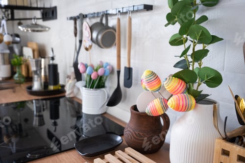 Preview: Interior of kitchen and details of decor of utensils with Easter decoration of colorful eggs in a lo