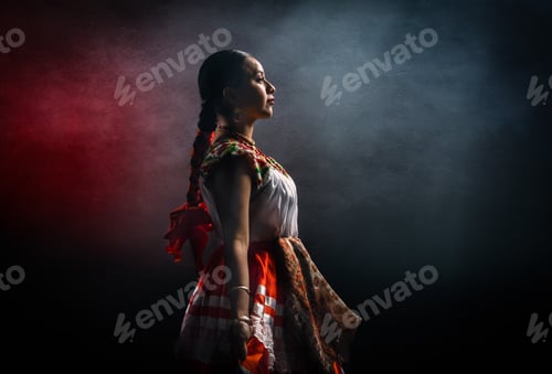 Preview: A woman in a red dress stands in front of a dark background