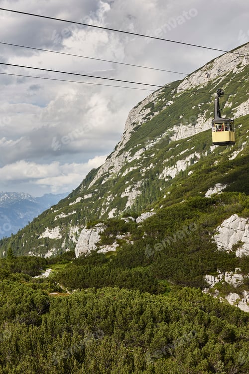 Preview: Picturesque yellow cable car in Dachstein mountain range. Austria