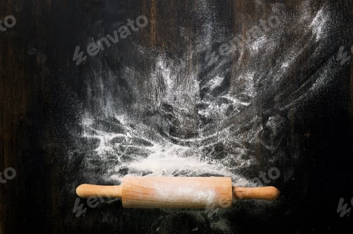Preview: Baking background with free space for your text. Rolling pin and flour on black table. Copy space