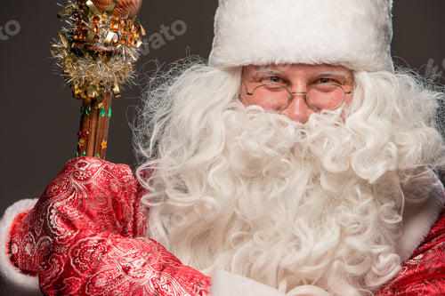 Preview: Happy Santa Claus In Eyeglasses With Staff Looking At Camera On Black Background