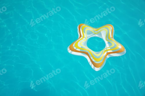 Preview: Star shaped inflatable ring floating in swimming pool on sunny day, above view. Space for text