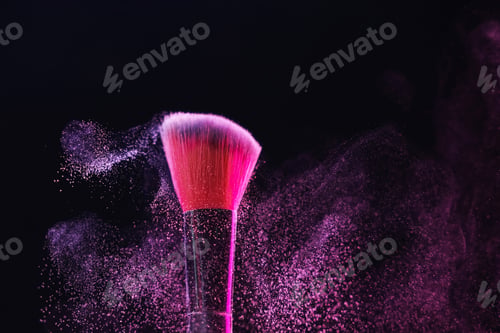 Preview: Makeup brush with color eye shadow on black background, closeup