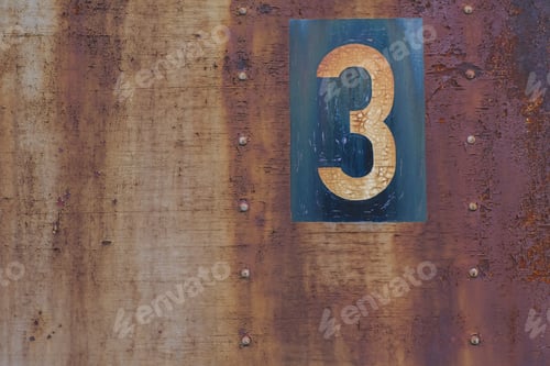 Preview: Close shot of a number 3 written on a rusty metal surface