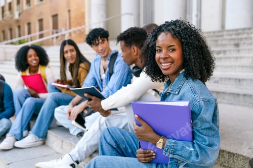 Preview: Diverse students smiling sitting on university campus stairs