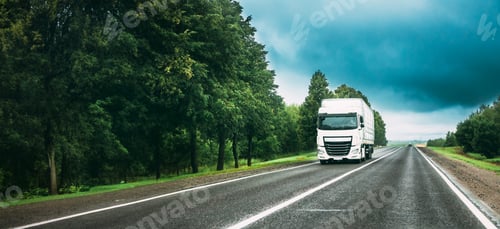 Preview: Truck Tractor Unit, Prime Mover, Traction Unit In Motion On Road, Freeway. Asphalt Motorway Highway