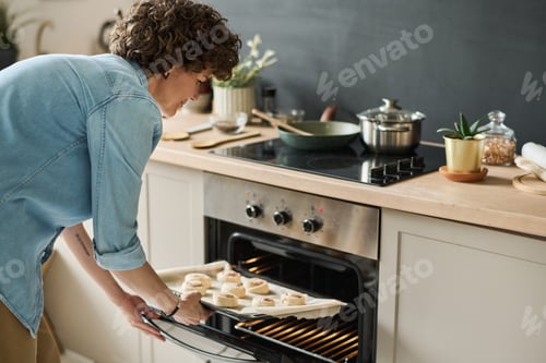 Preview: Woman baking sugar buns at home