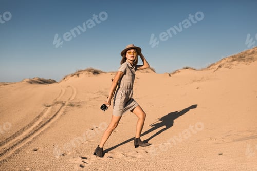 Preview: woman in desert walking on safari