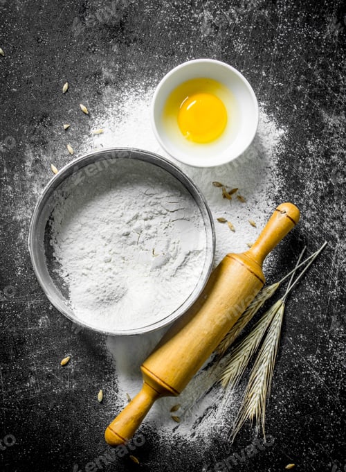 Preview: Flour in a sieve with a rolling pin and spikelets.