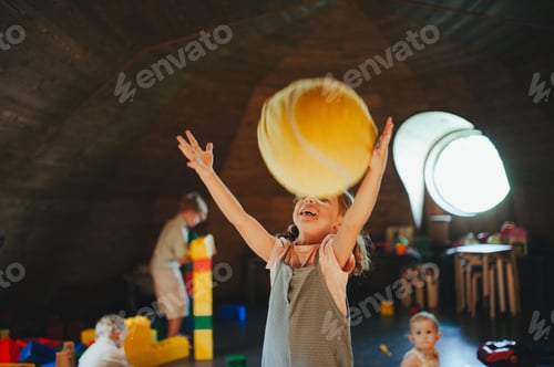 Preview: Children are playing together in indoor play area at a restaurant.