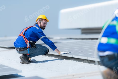 Preview: Both of technicians is installing solar panels on the roof of the warehouse