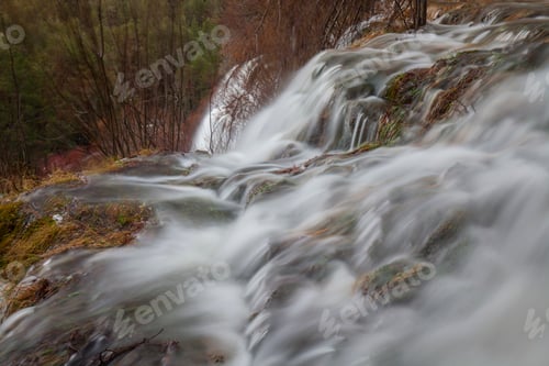 Preview: Wonderful waterfall near tree