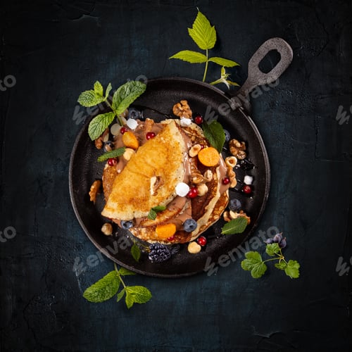 Preview: Pancakes with berries, nuts and chocolate sauce