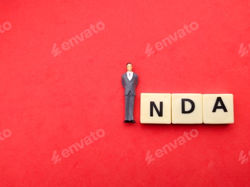 Preview: Miniature of a man with the word NDA on a red background with copy space