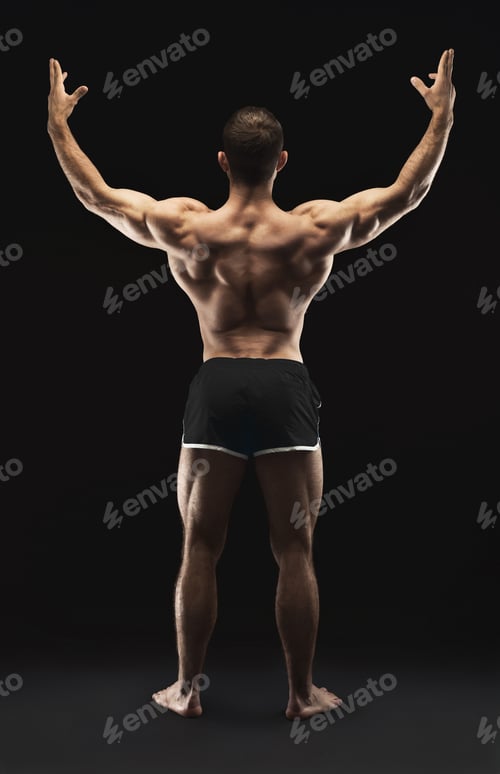 Preview: Unrecognizable man shows strong back muscles closeup