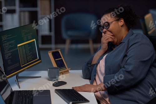 Preview: Tired programmer working till late night