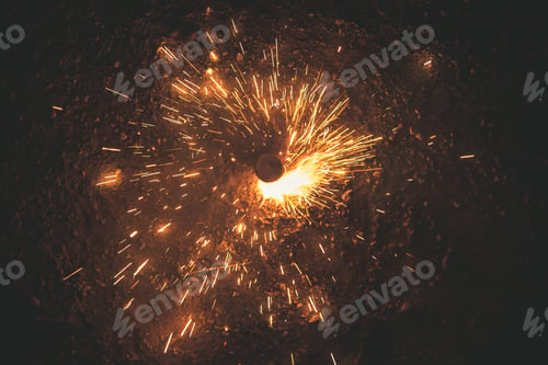 Preview: Firecrackers spinning illuminating the night with their sparks