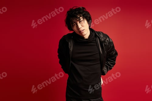 Preview: Style statement a young asian man strikes a pose in a studio