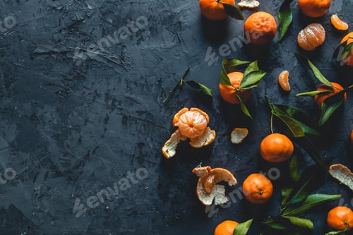 Preview: Juicy ripe tangerines with leaves on wooden table