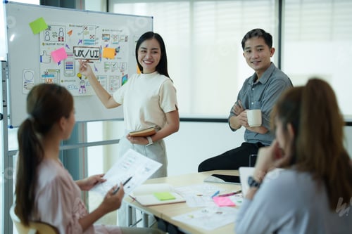 Preview: Group of asian creative teamwork discuss at business meeting for developing mobile phone app project