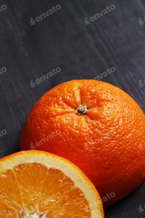 Orange Fruit Still Life on Dark Wooden Table