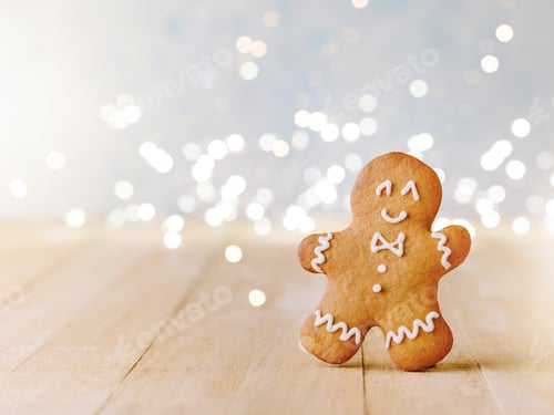 Preview: Christmas gingerbread cookies with Christmas decorations and garland with bokeh on wooden background